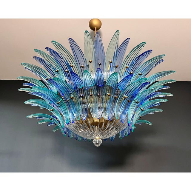 Luxury and genuine murano glass chandelier. Hand made in murano. It made by 82 murano blue and turquoise glasses, two...