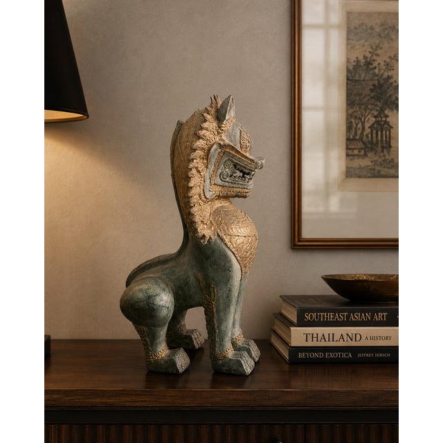 A commanding vintage Thai Singha (Guardian Lion) sculpture, expertly cast in hollow bronze and finished with a beautifully...