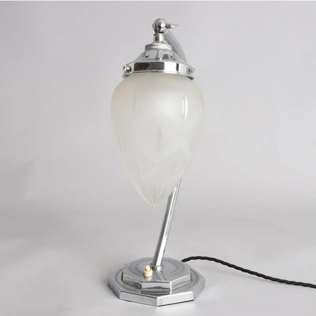 H: 36cm w: 13cm d: 13cm a british art deco table lamp with a stepped octagonal base and a glass teardrop shade with an...