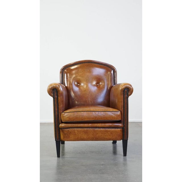 Offered byThijs is this striking sheep leather design armchair in good condition, luxuriously finished with decorative...