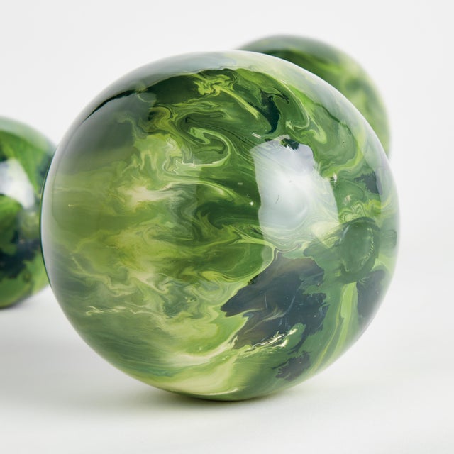 In a clever use of enameled iron, this lightweight orb is painted by hand. A refined, luminous design, each one prettier...