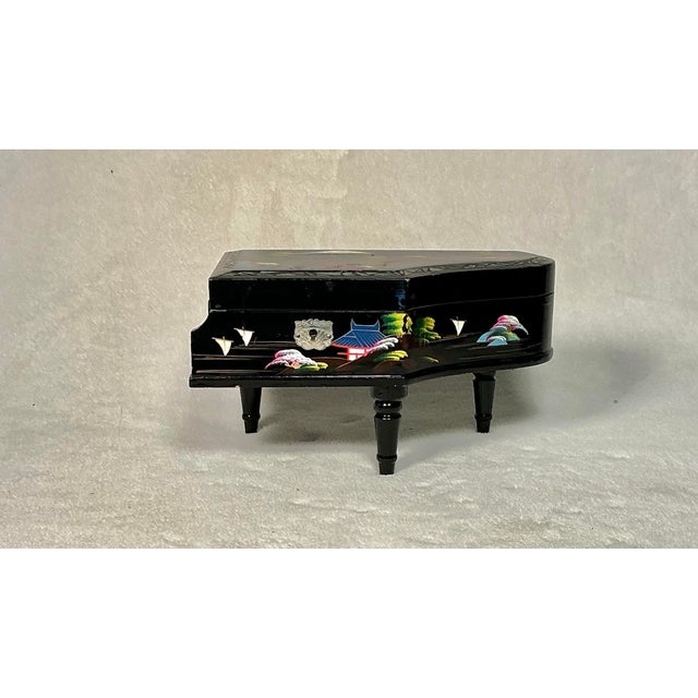 Vintage Mid-Century Japanese lacquered jewelry music box, shaped as a grand piano from the 1950s. This is a higher-end,...
