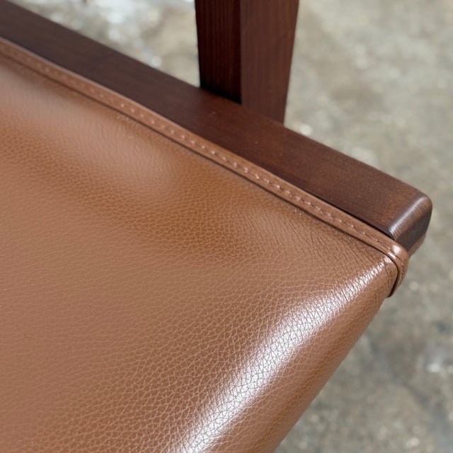 Attributed to Antonio Citterio for B&B Italia, the J.J Armchair exemplifies sophisticated modernism through its thoughtful...