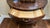 Traditional-style half-round console table of unknown brand, in colour walnut.