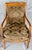 Elegant pair of mid-20th century French Directoire-style walnut armchairs, featuring gracefully curved open arms and...