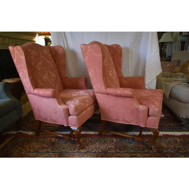 Custom Rose Nubby Raw Silk Damask Wingback chairs from the late 1960's. All the details of fine furniture without a...