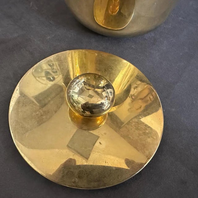 This is a 1970s Mid-Century Modern Italian ice bucket crafted from gilded metal. The bucket features a sleek cylindrical...