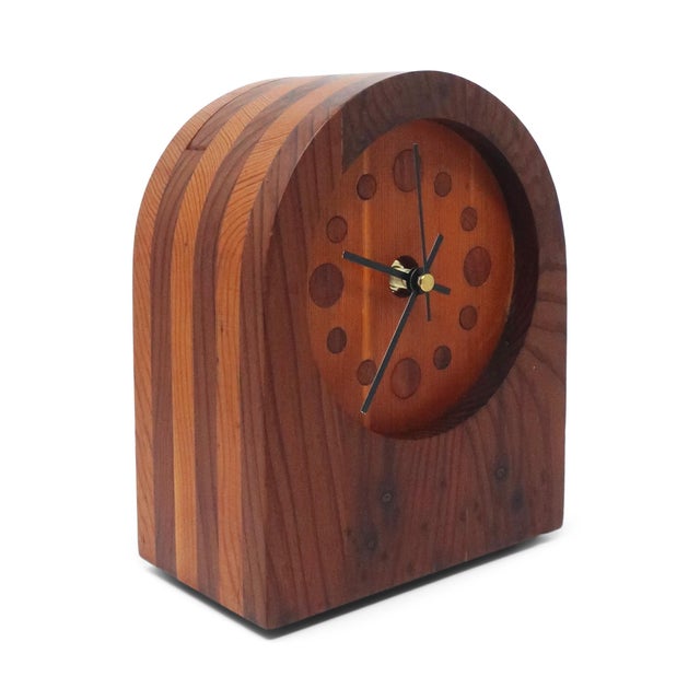 A stunning example of 1970s studio craft, this handmade desk clock showcases the era's celebration of natural materials...