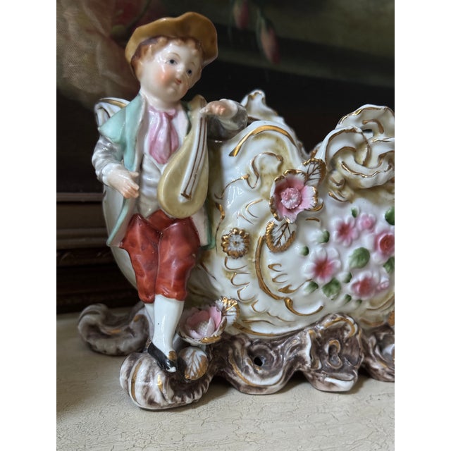 Charming matched two-piece vintage porcelain grouping in the Continental European Rococo Revival style, featuring a...