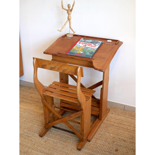 Vintage pine school desk with matching chair. A lovely vintage piece that's as decorative as it is practical, ideal for a...