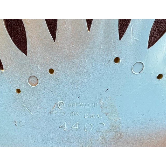 Burwood Wall Fan in A Gold Color with lots of Detail Scroll Work . The Burwood fan is made of Hard plastic .