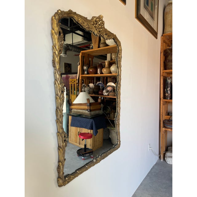 Elevate any space with this exquisite 1970s Italian Hollywood Regency carved wood wall mirror. Beautifully crafted, the...