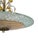 The plafond consists of a large circular glass shade with a warm champagne-toned center, surrounded by a broad border of...