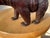 Very fine carving of a black forest bear walking on all fours paws. The life-like bear realistically carved and stained by...