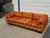 Striking vintage Mid-Century Modern pit sofa by Selig of Monroe featuring a bold geometric pattern in a warm palette of...