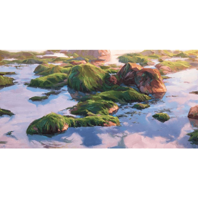 This artwork depicts a serene landscape of rocky outcrops partially submerged in shimmering water, adorned with vibrant...