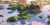 This artwork depicts a serene landscape of rocky outcrops partially submerged in shimmering water, adorned with vibrant...