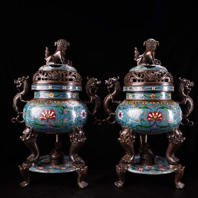 This impressive pair of incense burners is crafted from a gilt bronze body and richly decorated with cloisonné enamel....