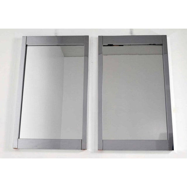 Elevate your space with a beautiful pair of clean-lined chrome frame mirrors by Milo Baughman, designed exclusively for...