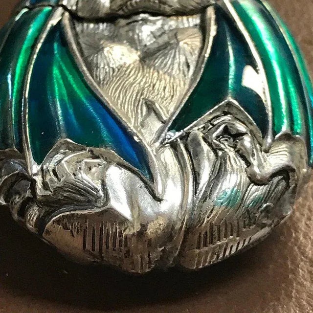 Silver plated and enameled bat matchsafe, realistically cast and chased, with enameled wings, unmaked.