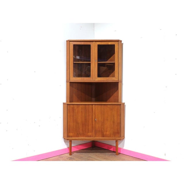 Discover the elegance of the Teak corner display cabinet, a great space-saving piece perfect for any mid-century modern...