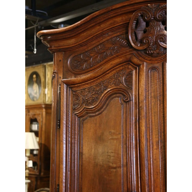 18th Century French Louis XV Carved Walnut Armoire Lyonnaise With Floral Motifs For Sale - Image 4 of 12