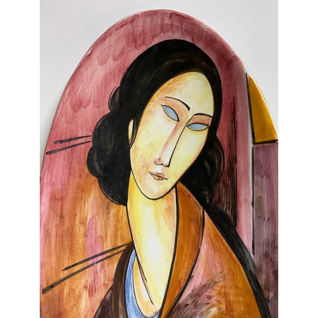 This is a beautifully hand-painted, artistic elongated bowl that is made in Italy. It is made to also hang on the wall as...