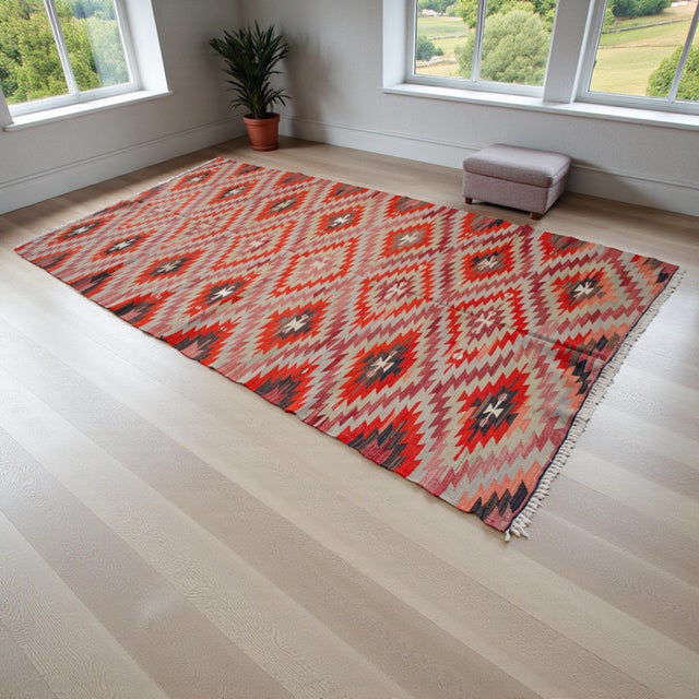 Handwoven in Turkey by Anatolian artisans, this authentic vintage Barak kilim from the 1960s blends traditional...