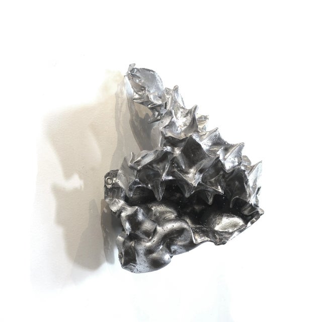 Atticus Adams' organically composed modern metal sculptures embody the transformative power of art, illustrating the...