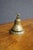 Antique brass table or service bell with a classic domed form and finely turned concentric detailing. The wide circular...