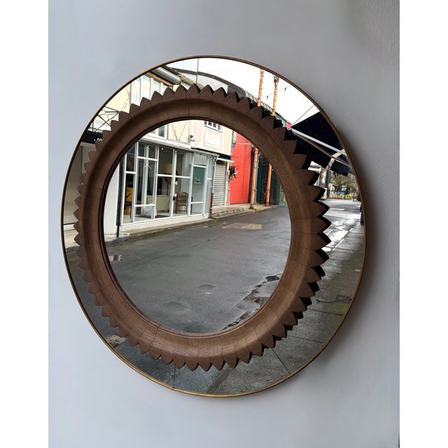 Mid-Century Modern wood and brass wall mirror, by the italian manufacture Fratelli Marelli. Famous design like brasilian...