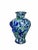 A sculptural art-glass vase featuring rich cobalt-blue and emerald-green patches against a cloudy pale ground with...