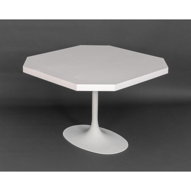 Eero Saarinen Style White Tulip Table, the white laminate square top with canted corners. 29" H x 42.25" W x 42.25" D....