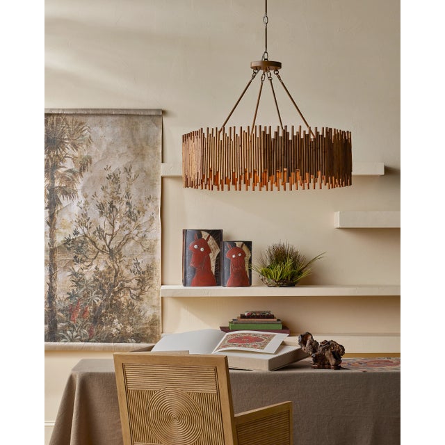 The Santos Sea Sand Armchair has a split rattan pattern on the back, and on the inside and outside of the arms, which is...