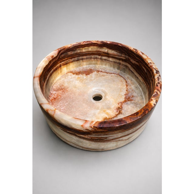 Elevate your bathroom with the timeless elegance of this luxury handcrafted onyx vessel sink. Expertly carved from genuine...