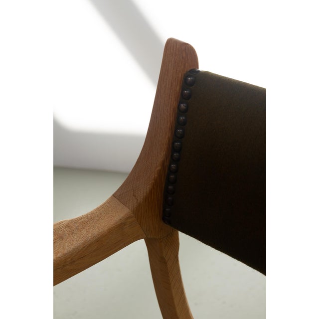 This Scandinavian Mid-Century Modern Curule chair in solid Nordic oak model "Kurul" is designed by Danish architect...