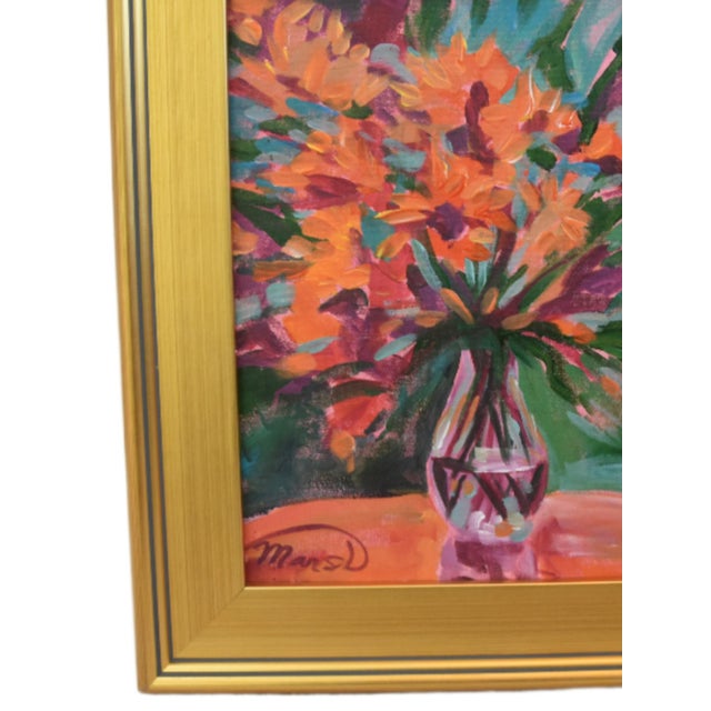 Still-life painting on canvas of an original Impressionist floral artwork featuring orange and red flowers in a clear...
