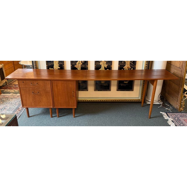 Design Plus Gallery presents a Teak Wood Office Desk with Separate Cabinet from the Mid 20th Century. This workspace is...