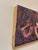 This oil painting presents a dynamic interplay of figures, rendered in bold, expressive strokes that evoke a sense of...