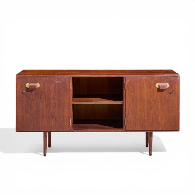 Jens Risom Mid Century Walnut and Brass Credenza This credenza measures: 54.25 wide x 20.25 deep x 27.5 inches high Good...