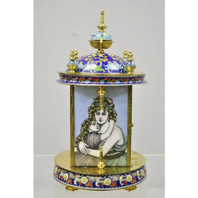 Vintage Chinese Cloisonne Brass Figural Porcelain Enamel Mantel Clock. Item features a cloisonne enamel case, brass frame,...
