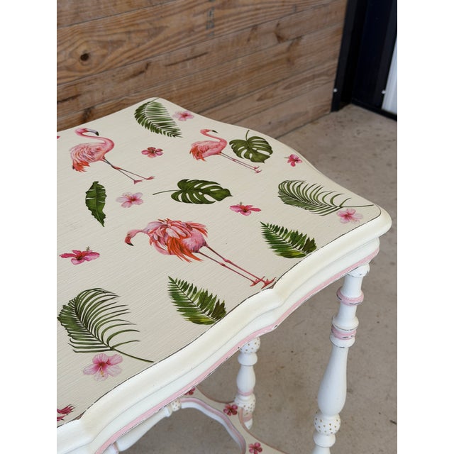 Charming antique console table reimagined with a custom hand-painted finish and flamingo decoupage top. This one-of-a-kind...