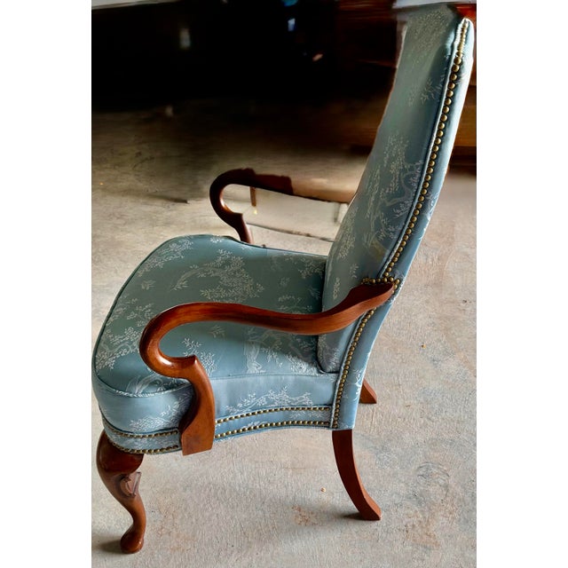 The design of the Louis XV style chair suggests it is intended as a decorative accent piece, offering both comfort and...