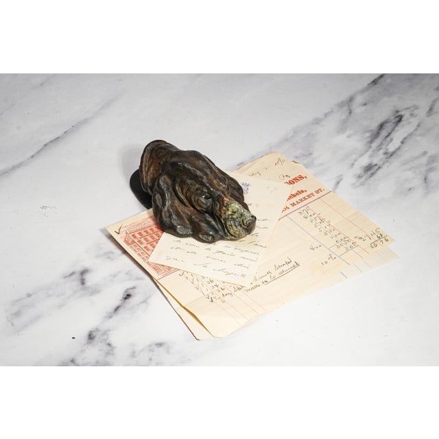 A wonderfully characterful circa 1930s antique document clip, this substantial desk accessory is modeled as the expressive...