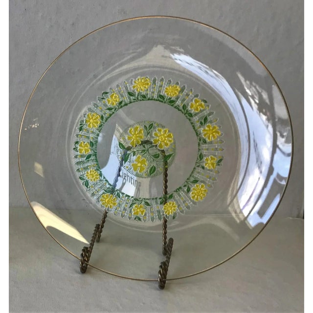 Very rare 1960's vintage round glass serving dish. The multi-color daisy and picket fence pattern has varying shades of...