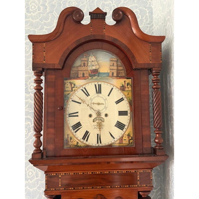 An early 19th century Welsh longcase (grandfather) clock signed John Rees, Harlech. This elegant tall case clock features...