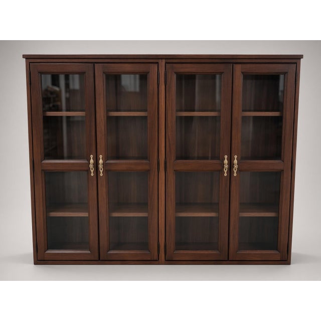 This classic mahogany Georgian colonial executive bookcase with glass doors on cadenza is a sophisticated piece of...