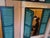 This captivating contemporary acrylic painting by Anna Maria Caboni presents the illuminated façade of an apartment...