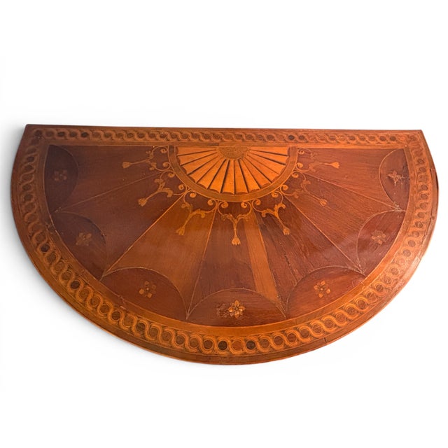 Measurements of floor footprint: 31 7/8” height x width of 30 1/4” Antique Gilt wood, original gilt base, demi-lune...