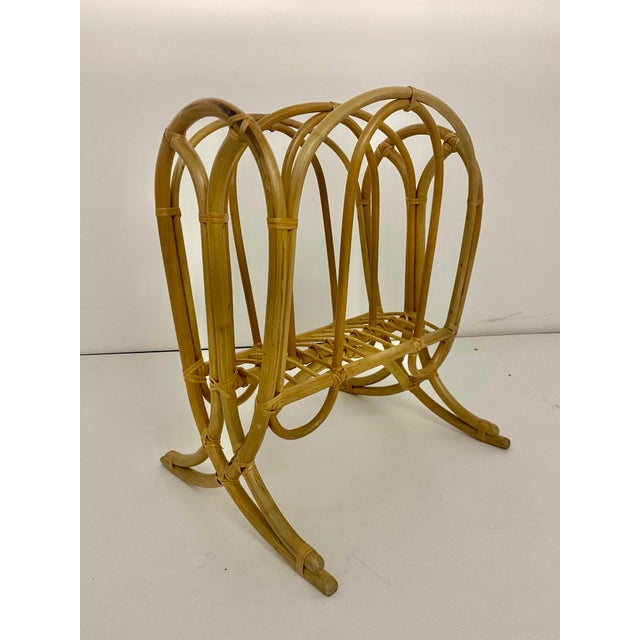 Handcrafted from natural bent bamboo and rattan cane wrapping.It features a symmetrical, open-slatted center cradle for...